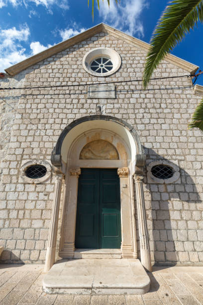 Monastery of Our Lady of snow Front door of the Franciscan Monastery in Cavtat, Croatia. cavtat photos stock pictures, royalty-free photos & images