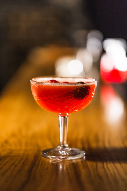 istock Three colorful cocktails in large glasses in a classic bar environment 970441802