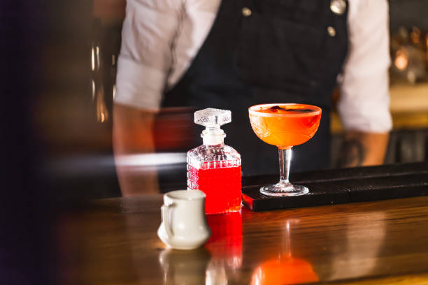 istock Three colorful cocktails in large glasses in a classic bar environment 970441840