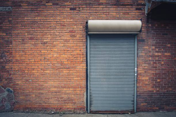 istock metal door in a brick wall 970444554