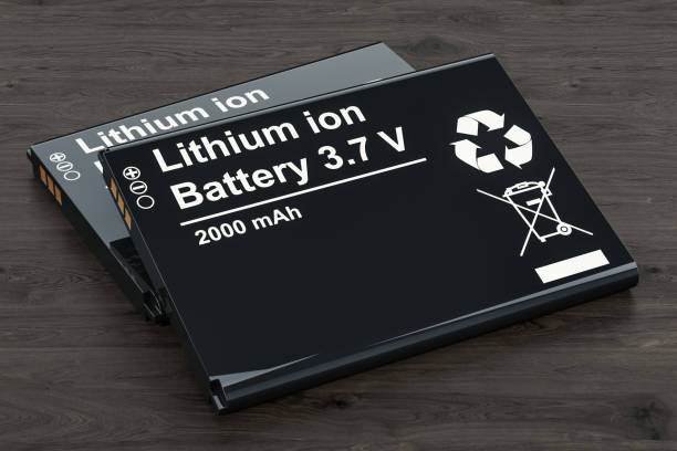Battery or accumulator for phone on the wooden table, 3D rendering Battery or accumulator for phone on the wooden table, 3D rendering lithium ion battery stock pictures, royalty-free photos & images