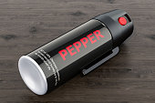 Pepper spray on the wooden table, 3D rendering