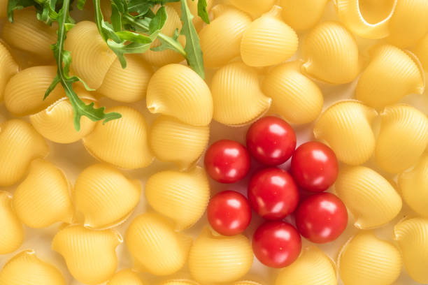 istock Food background Uncooked Macaroni Lumaconi 970445558