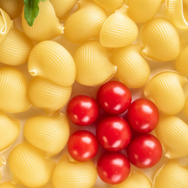 istock Food background Uncooked Macaroni Lumaconi 970445560