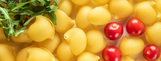 istock Food background Uncooked Macaroni Lumaconi 970453222