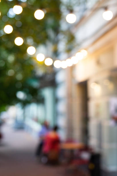 istock Blurred view of street cafe lights. 970460044