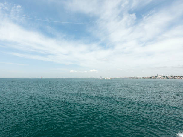 istock blue sky with clouds closeup. blue sky and sea background 970460278