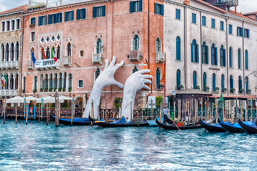 VENICE, ITALY - APRIL 29: The scenic monumental sculpture of a child's hands called \