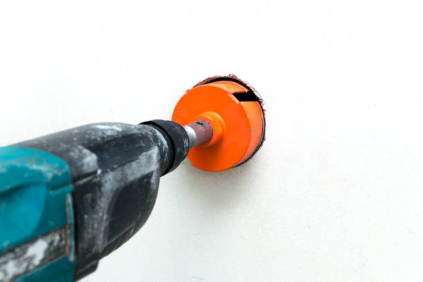 istock rotary hammer drills holes for outlets 970475712