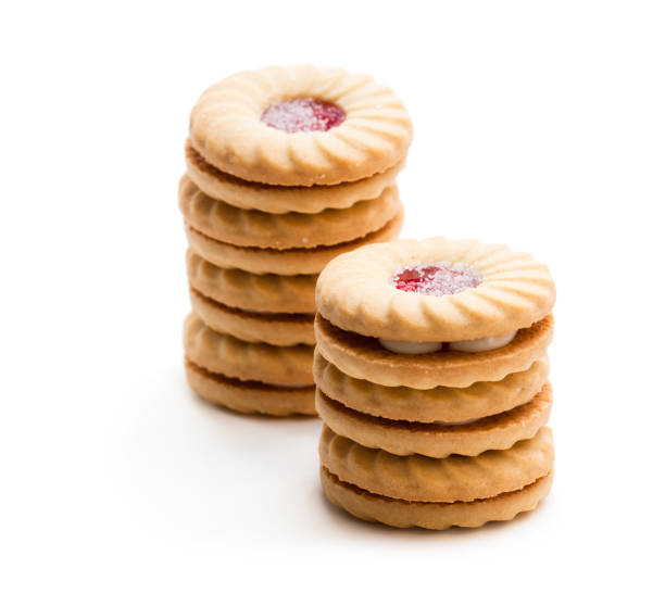 istock Stacked  shortcake biscuits sandwiched with cream and jam isolated on white 970482642