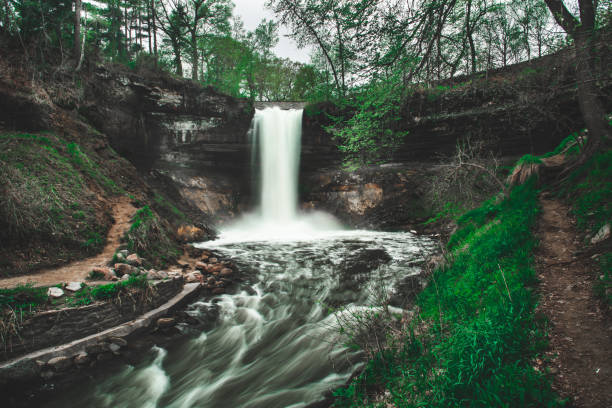 istock Slow shutter speed shot of waterfall that makes it look silky smooth 970489376