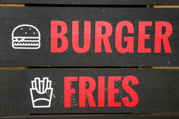istock Red text on the blackboard - burgers and fries menu 970490062