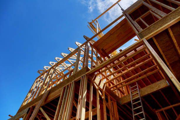 istock Framing of house Closeup new stick built home under construction under blue sky construction and real estate 970492998