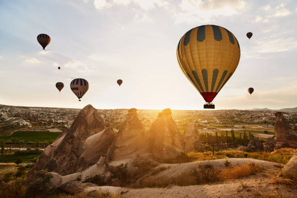 istock Hot Air Balloons Flying at Sunset, Cappadocia, Turkey 970498444