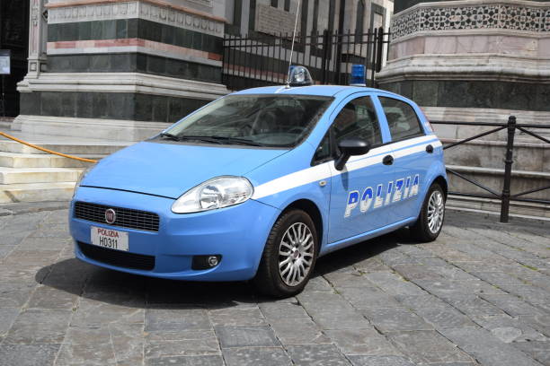 Fiat Grande Punto police car on the street Florence, Italy - 14 May, 2015: Fiat Grande Punto police car stopped on the street. This vehicle is used to patrols on the streets. punto stock pictures, royalty-free photos & images