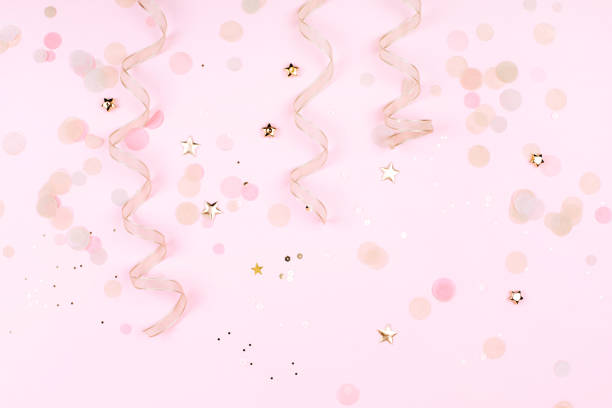 istock Golden decorations on pink pastel background. 970516606