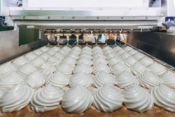 istock Confectionery factory. Zephyr and marshmallows production machine 970519562