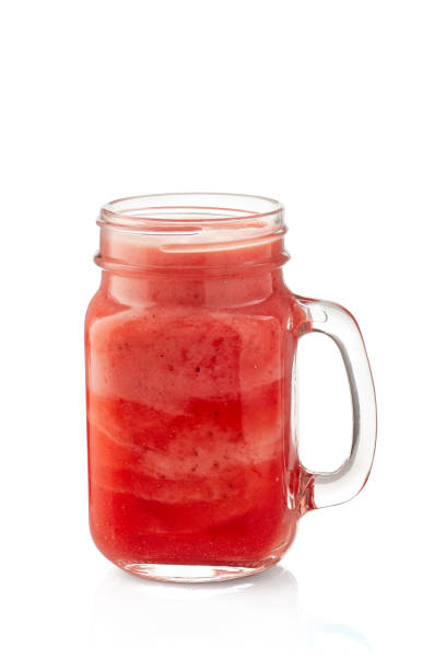 istock Yogurt and strawberry smoothie in jar on white 970521668