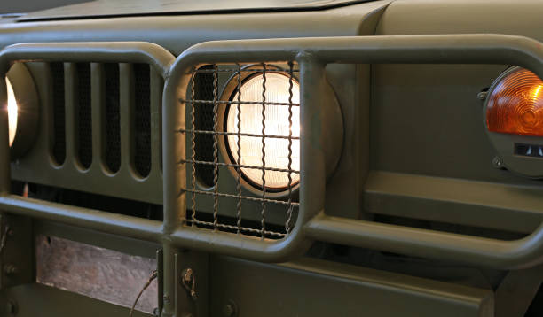 istock Light from front of military car headlight. 970527464