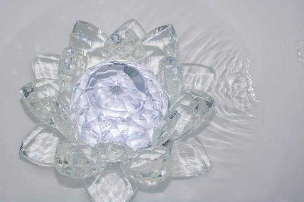 istock lotus-shaped crystal over water 970527560