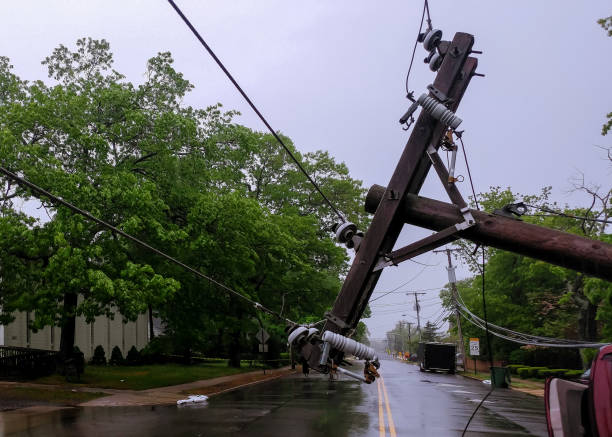 istock electric pole after hurricane damaged car turned over after accident 970534062