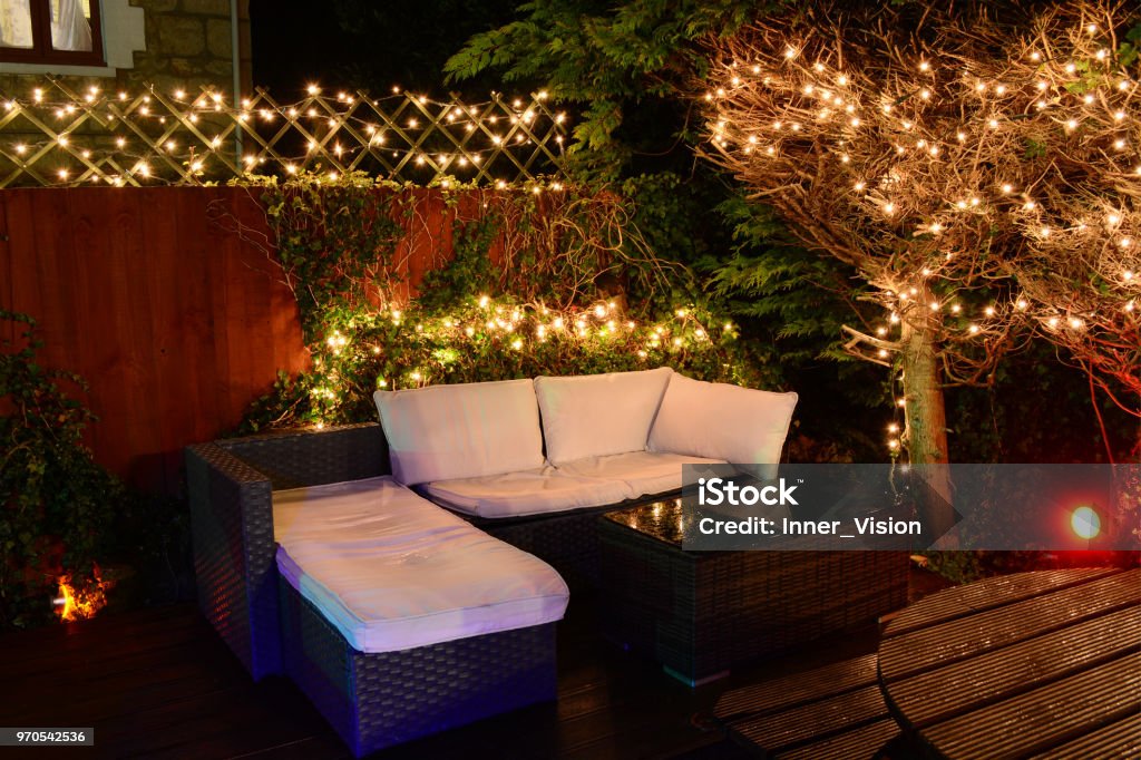 Illuminated Garden Seating and Fairy Lights Illuminated garden seating and fairy lights. Christmas Lights Stock Photo