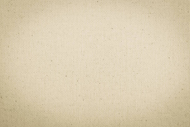 Hessian sackcloth woven texture pattern background in light cream beige brown color