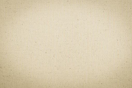 Hessian sackcloth woven texture pattern background in light cream beige brown color