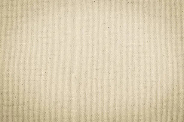 Photo of Hessian sackcloth woven texture pattern background in light cream beige brown color