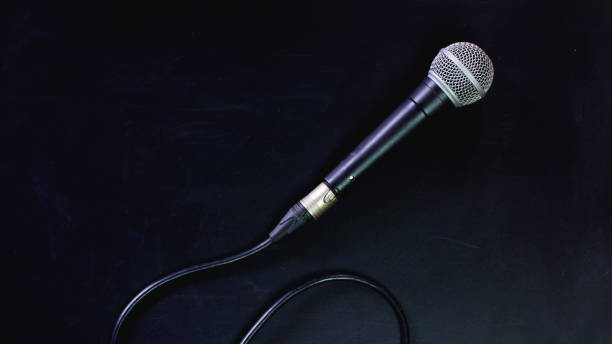 istock Microphone and line on the blackboard. 970550412