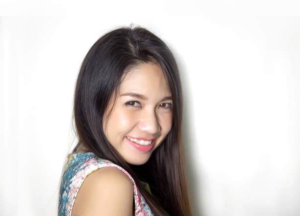 istock cute asian lady smile with pink lipstick on studio shot. 970559836