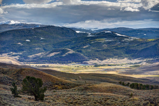 istock Wyoming hills and mountains, sunlit valley 970565408