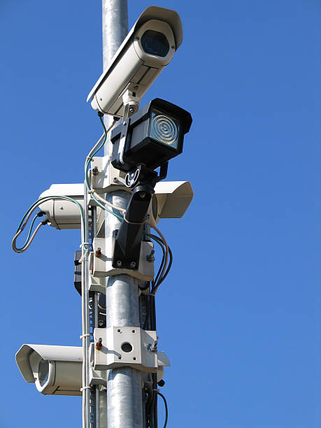 istock CCTV cameras in front of a clear blue sky 97057833