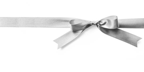 istock Silver satin ribbon color stripe fabric bow isolated on white background with clipping path 970583962