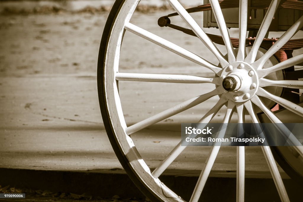 Wooden wheel Wooden wheel of a horse drawn carriage. Carriage Stock Photo