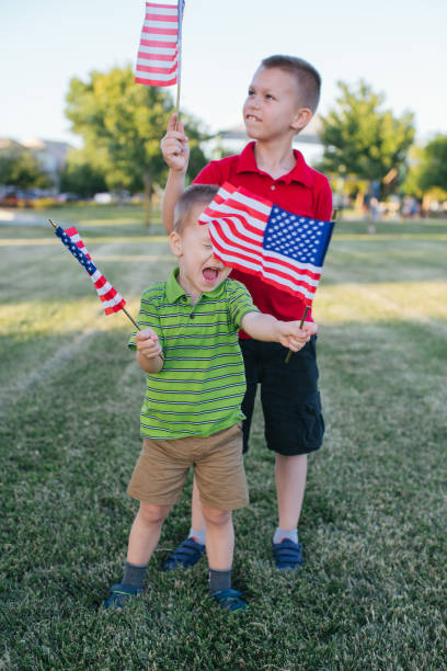 istock Kids waving American flags 970590170