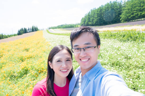 istock couple with landscape in Furano 970592782