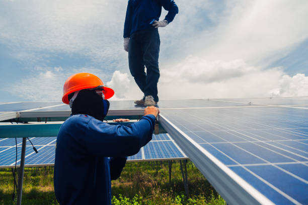istock engineer team working on replacement solar panel in solar power plant;engineer and electrician team swapping and install solar panel ; electrician team checking hot spot on break panel 970596314