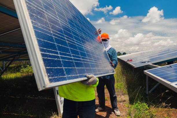 istock engineer team working on replacement solar panel in solar power plant;engineer and electrician team swapping and install solar panel ; electrician team checking hot spot on break panel 970596316