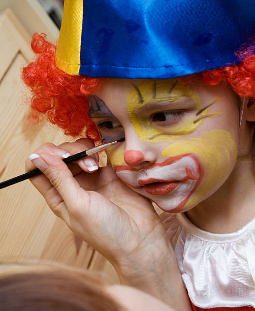 the boy wearing payaso - face paint human face mask carnival fotografías e imágenes de stock