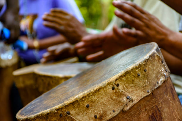 Afro-brazilian cultural manifestation Percussionist playing a rudimentary atabaque during afro-brazilian cultural manifestation samba dancing stock pictures, royalty-free photos & images