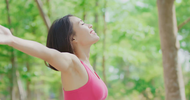 istock woman feel free in forest 970603132