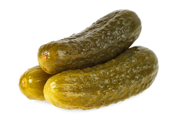 istock Close up of pickled cucumbers on a white background 970658852