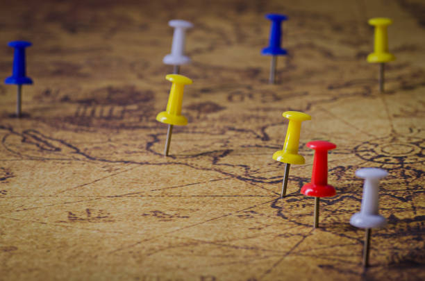 istock Close-Up Of Colorful Thumbtacks On Map 970664244