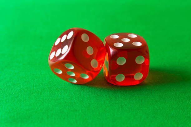 istock Dice on a green background . Game concept. Games of chance 970668256
