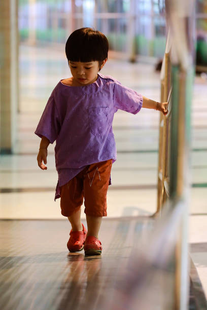 istock little boy is stand alone and looking at something with confuse on his face 970669208