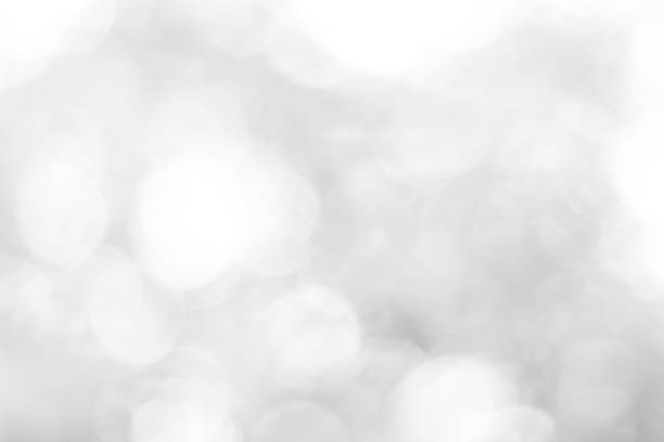 istock white blurred backdrop of nature, circle white wallpaper, gray bokeh background 970676556