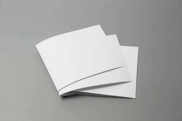 istock Blank portrait mock-up paper. brochure magazine isolated on gray, changeable background / white paper isolated on gray 970679230