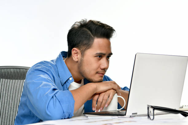 istock Casually-dressed startup business man sitting in relaxed posture after having work done easily 970689338