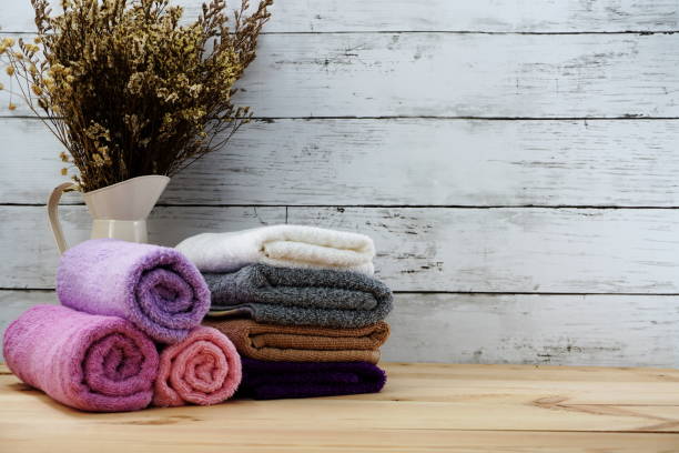 istock spa towels with space copy on wooden background 970689404